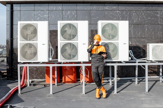 close-up-workman-servicing-air-conditioning-concept